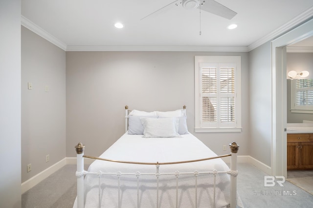 bedroom with crown molding, connected bathroom, carpet flooring, and ceiling fan