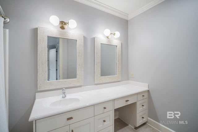 bathroom featuring ornamental molding and vanity with extensive cabinet space