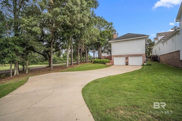 view of front of property featuring a garage and a front yard