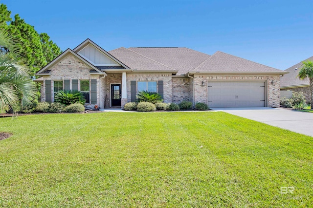 view of front of house featuring a front yard and a garage