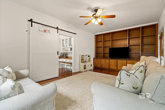 14 Macy Pl, Mobile, AL 36604 - living area with a barn door, a ceiling fan, crown molding, wood finished floors, and built in features