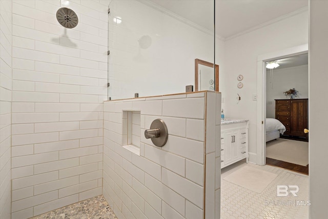 14 Macy Pl, Mobile, AL 36604 - bathroom with ornamental molding, tiled shower, connected bathroom, and vanity