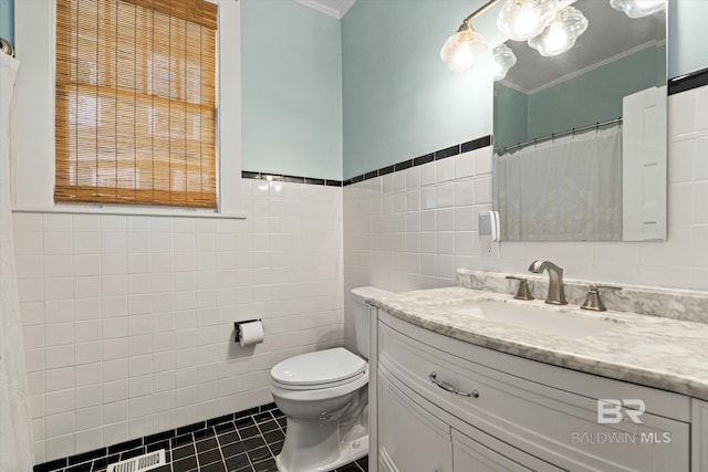14 Macy Pl, Mobile, AL 36604 - bathroom featuring tile walls, ornamental molding, vanity, tile patterned flooring, and a wainscoted wall