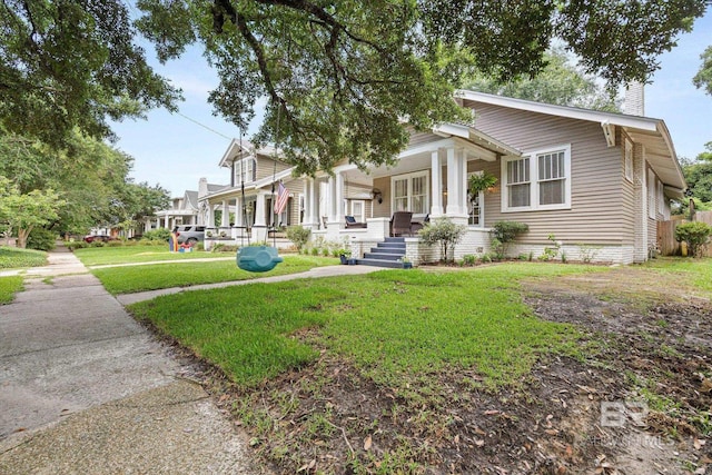 14 Macy Pl, Mobile, AL 36604 - view of front of property featuring covered porch, a chimney, and a front lawn