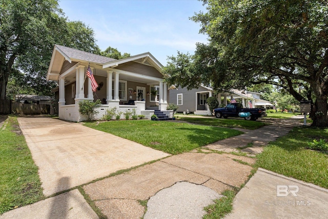 14 Macy Pl, Mobile, AL 36604 - view of front of property with concrete driveway, covered porch, roof with shingles, and brick siding