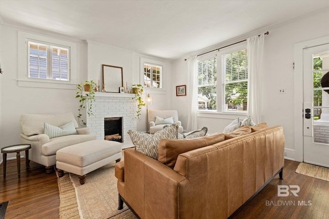 14 Macy Pl, Mobile, AL 36604 - living room with dark wood-style flooring, a brick fireplace, and crown molding