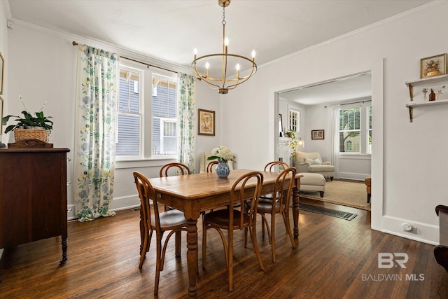 14 Macy Pl, Mobile, AL 36604 - dining area featuring wood finished floors, a chandelier, and ornamental molding