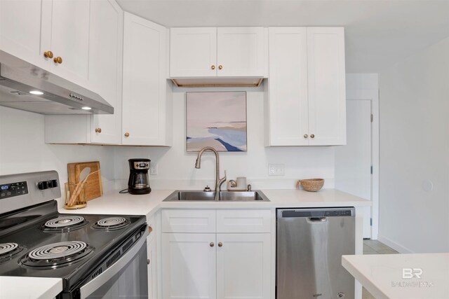 kitchen featuring sink, white cabinets, and stainless steel appliances