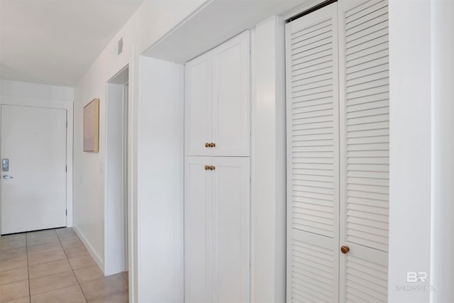 hallway with light tile patterned floors