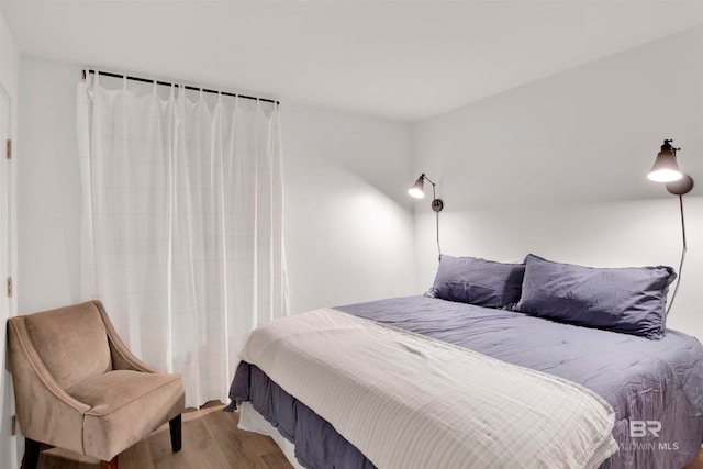 bedroom with light hardwood / wood-style floors