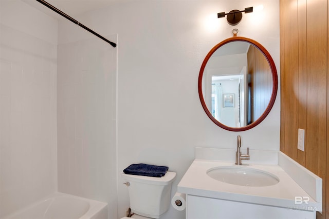 full bathroom featuring vanity, toilet, and washtub / shower combination