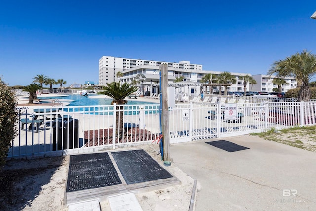 view of pool featuring a water view