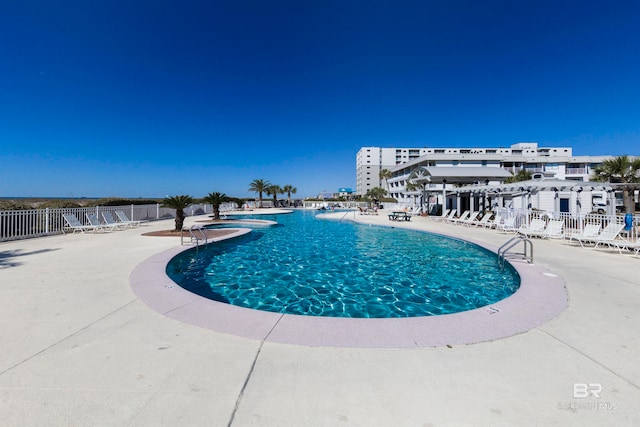 view of pool featuring a patio area