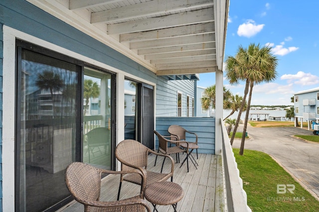 wooden terrace with a water view