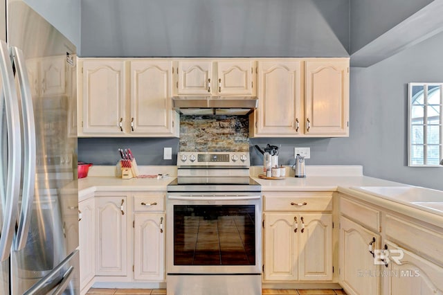 kitchen with stainless steel appliances, tasteful backsplash, exhaust hood, and light countertops