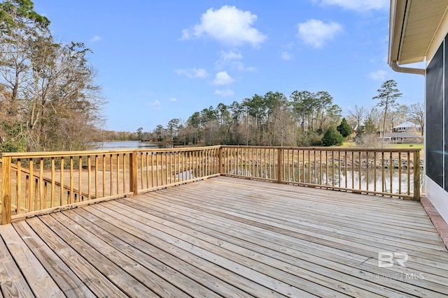 wooden terrace featuring a water view