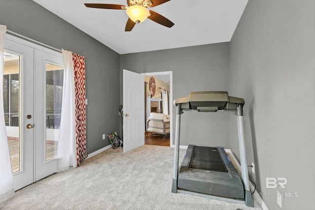 exercise area with carpet floors, baseboards, a ceiling fan, and french doors