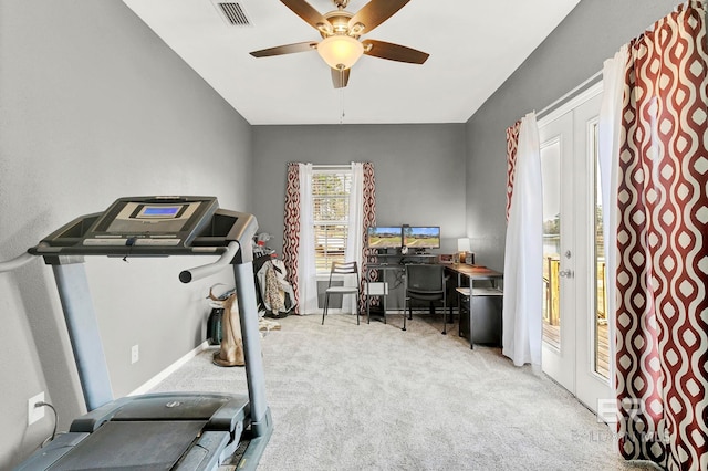 exercise area with ceiling fan, carpet floors, and visible vents