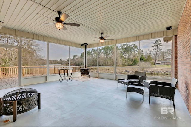 sunroom / solarium with ceiling fan