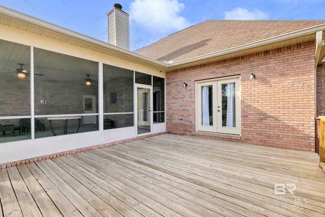 wooden deck featuring french doors and a sunroom