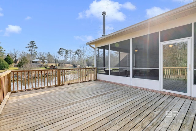 wooden deck with a sunroom