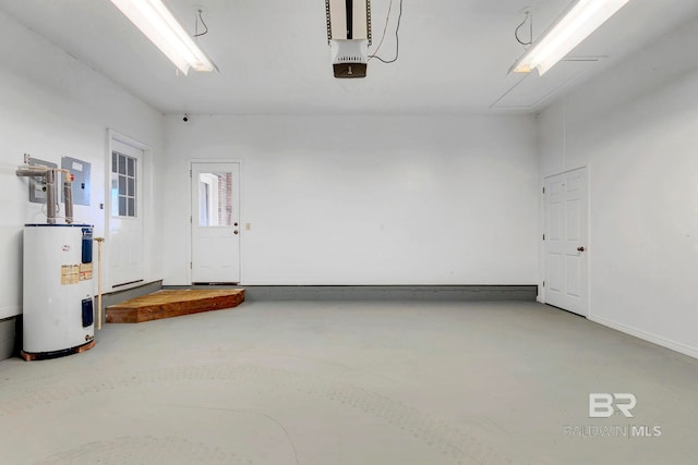 garage featuring a garage door opener, electric panel, and electric water heater