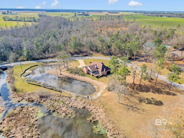 drone / aerial view with a water view and a rural view