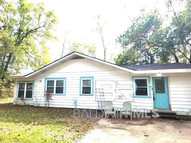 rear view of property featuring entry steps