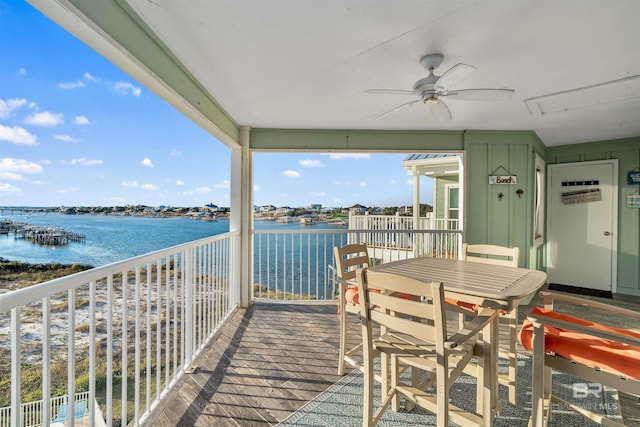 exterior space featuring a water view and a ceiling fan