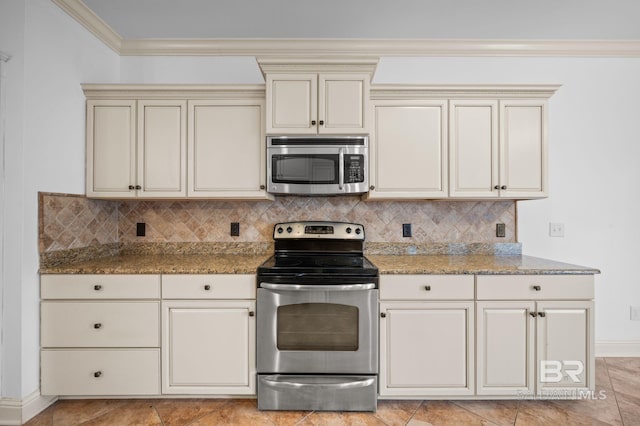 kitchen featuring tasteful backsplash, stone countertops, cream cabinetry, appliances with stainless steel finishes, and ornamental molding