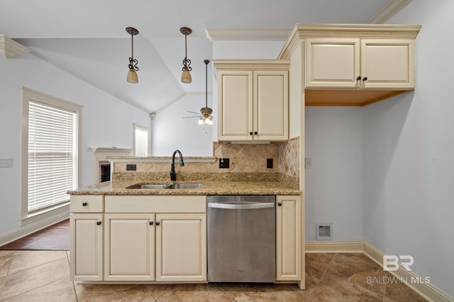 kitchen featuring ceiling fan, dishwasher, sink, lofted ceiling, and cream cabinetry