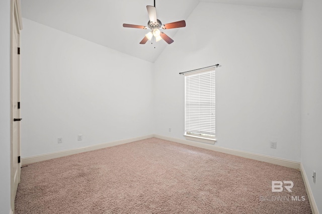 carpeted spare room with ceiling fan and high vaulted ceiling