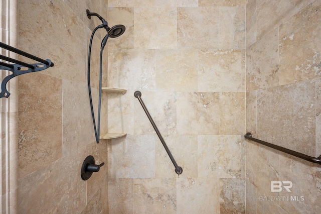 room details featuring a tile shower