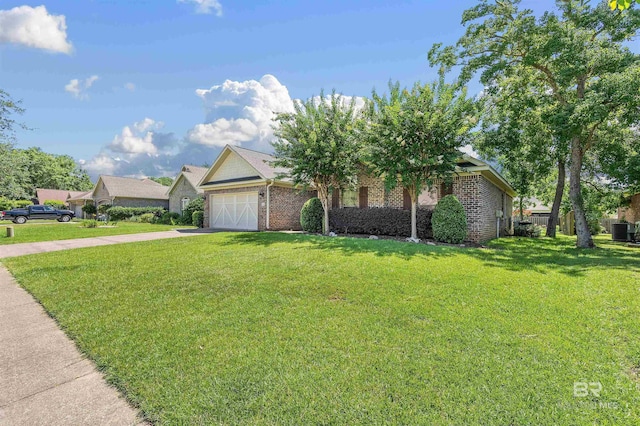 view of front of house featuring a garage and a front lawn