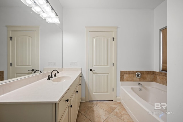 bathroom with tile patterned flooring, vanity, and a tub