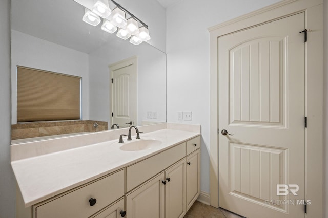 bathroom with tile patterned flooring and vanity