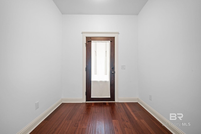 spare room with dark hardwood / wood-style floors