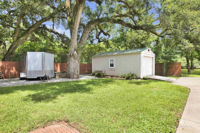 4340 Hamilton Oaks Ln, Mobile, AL 36695 - view of yard with an outbuilding, a garage, and driveway