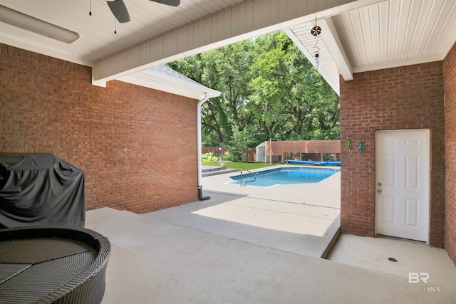 4340 Hamilton Oaks Ln, Mobile, AL 36695 - view of swimming pool with ceiling fan, a shed, a patio, and a fenced backyard