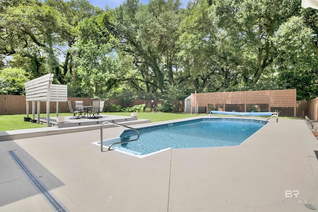 4340 Hamilton Oaks Ln, Mobile, AL 36695 - view of pool with a storage unit, a fenced backyard, a patio, and view of scattered trees