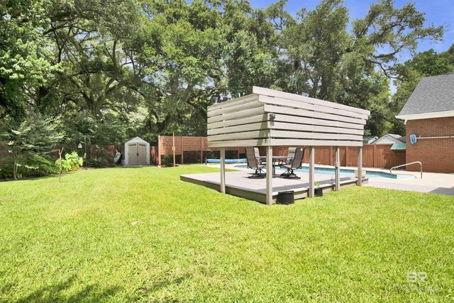 4340 Hamilton Oaks Ln, Mobile, AL 36695 - view of yard with a storage shed and view of wooded area