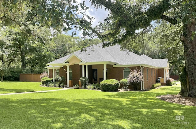 4340 Hamilton Oaks Ln, Mobile, AL 36695 - view of front of home featuring a front yard, roof with shingles, and brick siding