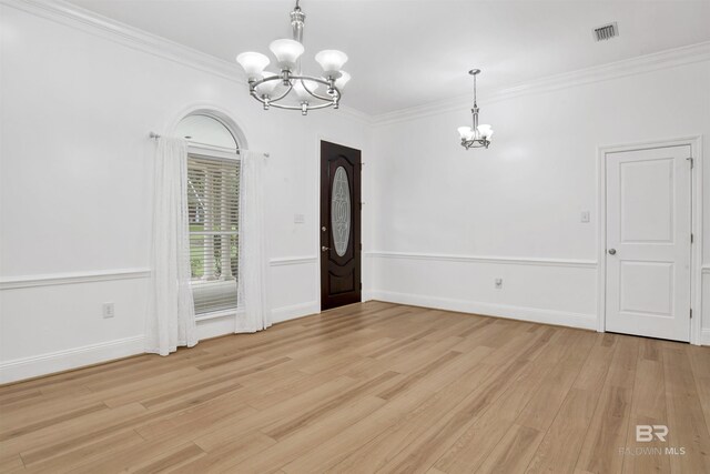 4340 Hamilton Oaks Ln, Mobile, AL 36695 - unfurnished dining area featuring a chandelier, light wood-style floors, and crown molding