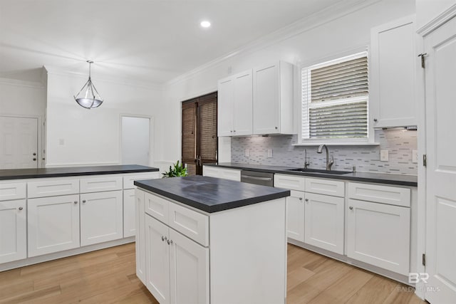 4340 Hamilton Oaks Ln, Mobile, AL 36695 - kitchen featuring dark countertops, crown molding, backsplash, white cabinets, and recessed lighting