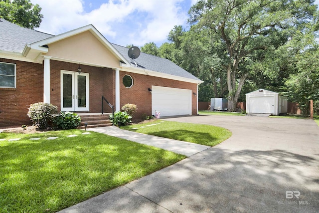 4340 Hamilton Oaks Ln, Mobile, AL 36695 - ranch-style house featuring driveway, a front yard, brick siding, and french doors