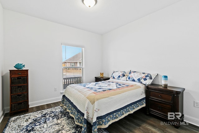 bedroom with dark wood-type flooring