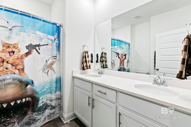 bathroom featuring vanity, toilet, and a shower with shower curtain