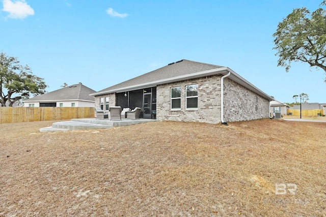 rear view of house featuring a patio