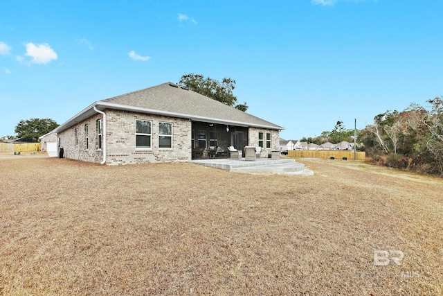 rear view of property featuring a patio