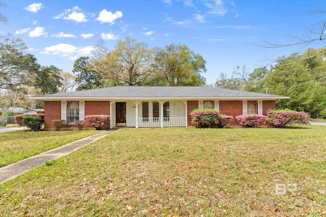 ranch-style house with brick siding and a front lawn